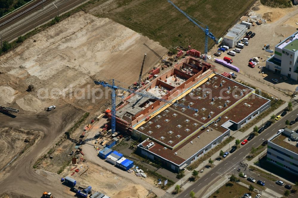 Berlin from the bird's eye view: Construction site of the function and archive building UB-Magazin - Speicherbibliothek and Universitaetsarchiv on Wagner-Regeny-Strasse in the district Adlershof in Berlin, Germany