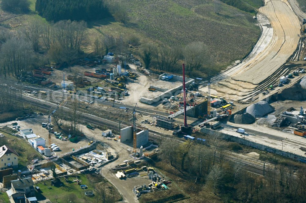 Zossen from above - Construction site for the new construction and assembly of the railway bridge structure for the route of the railway tracks and tunnel construction. New passenger tunnel to the train station on Stubenrauchstrasse in Zossen in the state Brandenburg, Germany