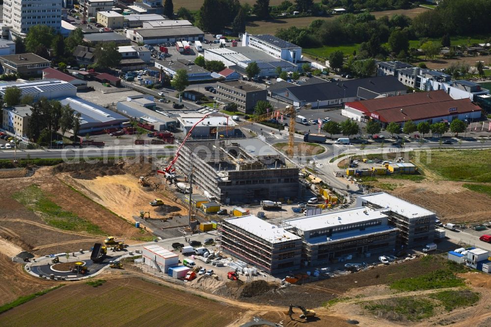 Aerial photograph Steinbach (Taunus) - New building construction site in the industrial park Im Gruendchen at the traffic roundabout Europakreisel on Bahnstrasse corner Industriestrasse in Steinbach (Taunus) in the state Hesse, Germany
