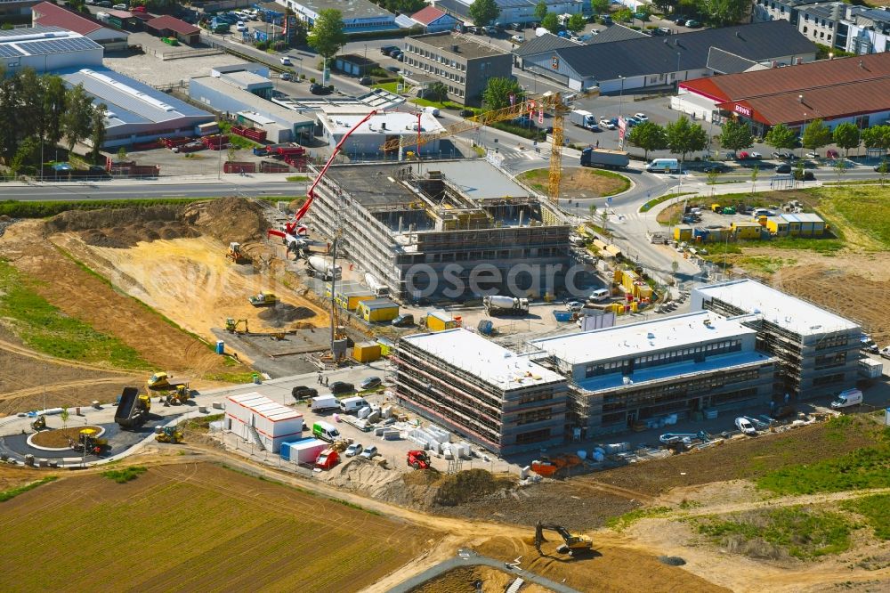 Steinbach (Taunus) from above - New building construction site in the industrial park Im Gruendchen at the traffic roundabout Europakreisel on Bahnstrasse corner Industriestrasse in Steinbach (Taunus) in the state Hesse, Germany