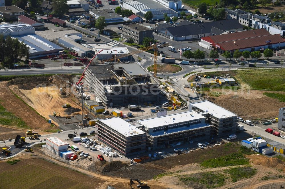 Aerial image Steinbach (Taunus) - New building construction site in the industrial park Im Gruendchen at the traffic roundabout Europakreisel on Bahnstrasse corner Industriestrasse in Steinbach (Taunus) in the state Hesse, Germany