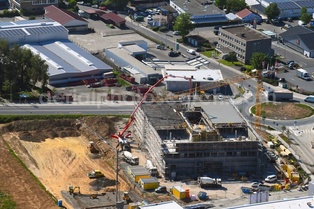 Aerial photograph Steinbach (Taunus) - New building construction site in the industrial park Im Gruendchen at the traffic roundabout Europakreisel on Bahnstrasse corner Industriestrasse in Steinbach (Taunus) in the state Hesse, Germany