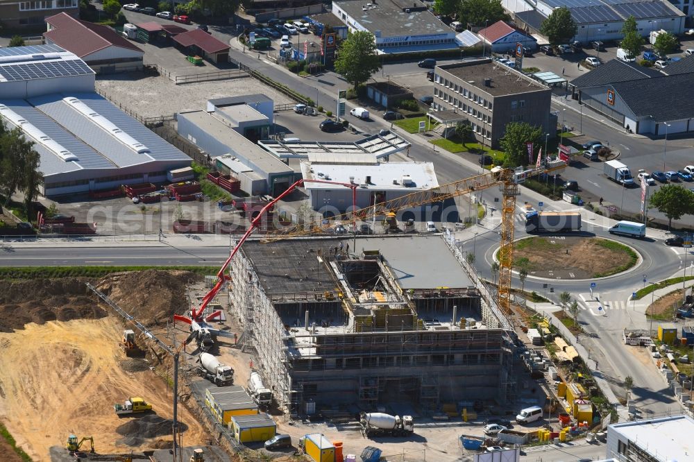 Steinbach (Taunus) from above - New building construction site in the industrial park Im Gruendchen at the traffic roundabout Europakreisel on Bahnstrasse corner Industriestrasse in Steinbach (Taunus) in the state Hesse, Germany
