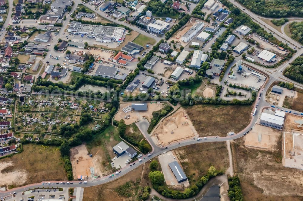 Schönkirchen from the bird's eye view: New construction site in the commercial area along the street Pahlbloken on the federal highway B502 in Schoenkirchen in the state Schleswig-Holstein, Germany