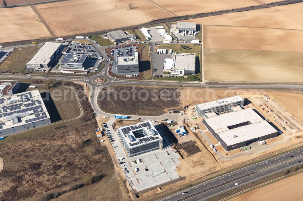 Rülzheim from the bird's eye view: New building - construction site on the factory premises of Eizo GmbH on Gewerbegebiet Nord in Ruelzheim in the state Rhineland-Palatinate, Germany