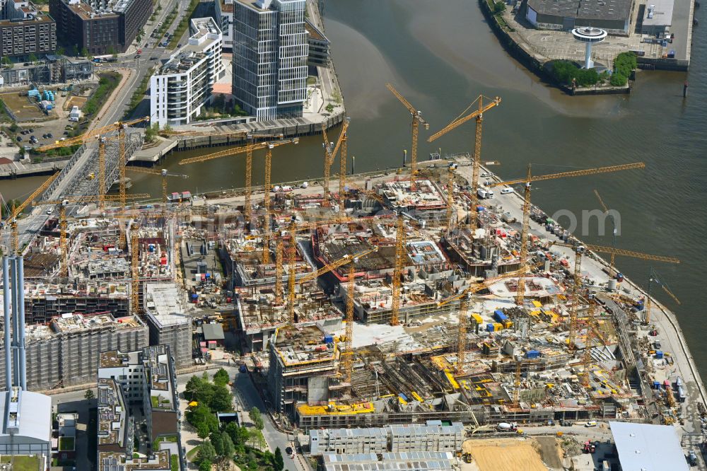 Hamburg from the bird's eye view: Construction site for the new building complex of the shopping center at Ueberseequartier at Chicagokai - Osakaallee in the area of the former Grasbrooks in the Hafencity district in Hamburg, Germany