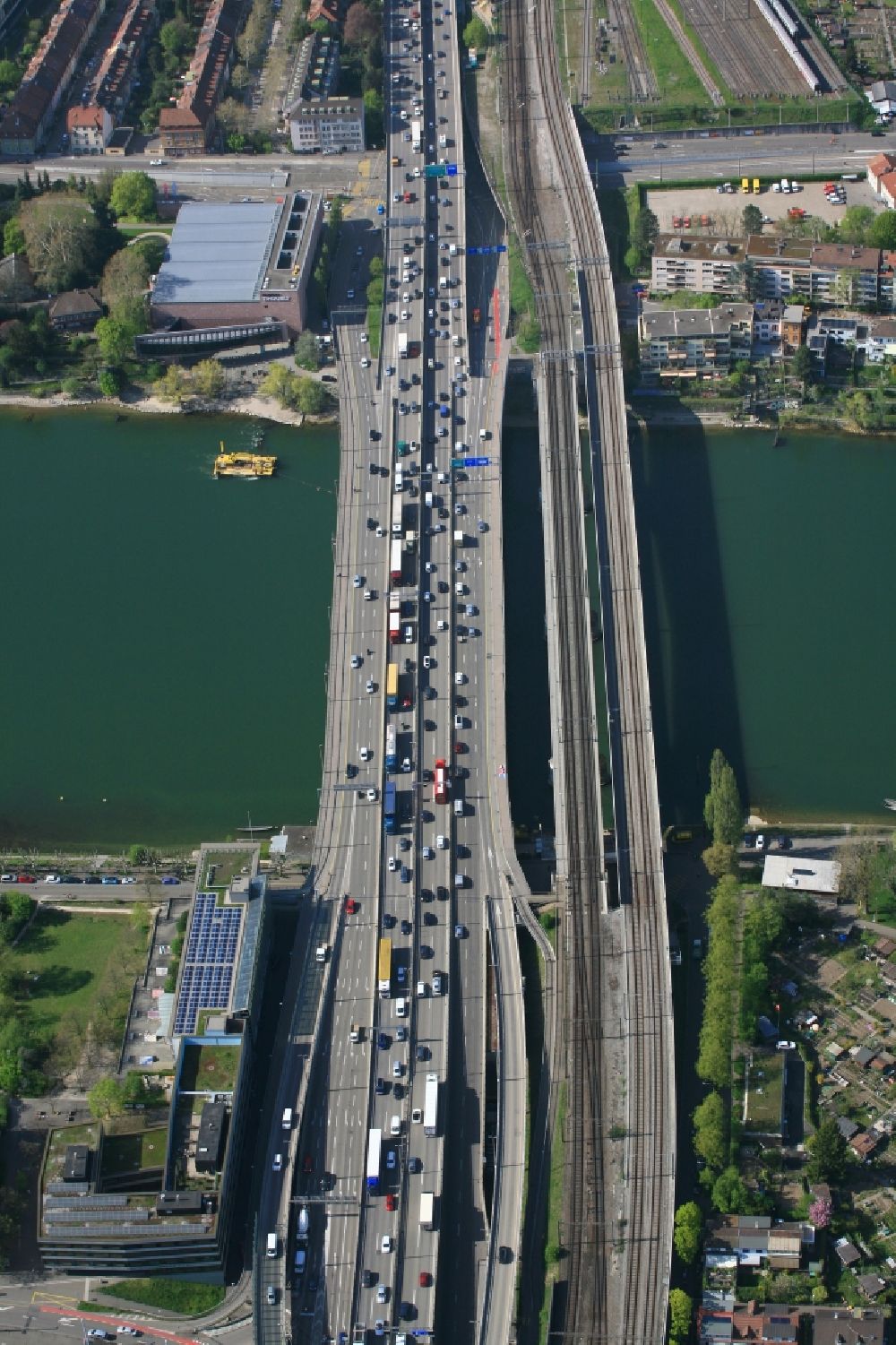 Aerial photograph Basel - New construction of the four-lane railway Black Forest bridge for the transalpine axis in Basel, Switzerland. Parallel the motorway A3 with traffic jam