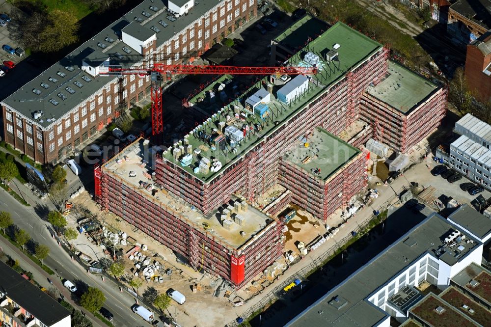 Berlin from the bird's eye view: Construction site to build a new office and commercial building on Bornitzstrasse in the district Lichtenberg in Berlin, Germany