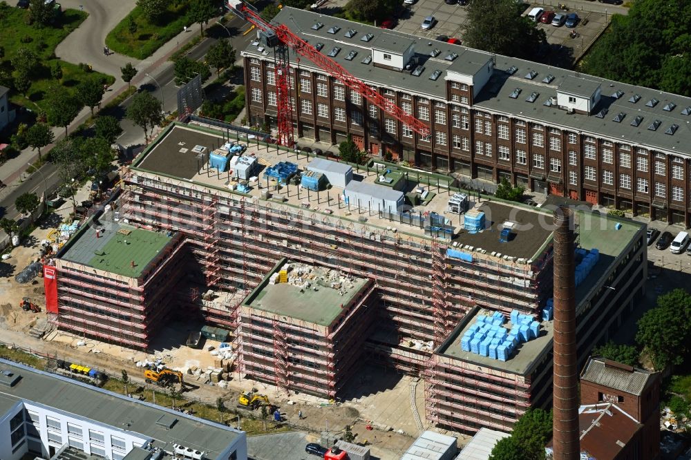Berlin from the bird's eye view: Construction site to build a new office and commercial building on Bornitzstrasse in the district Lichtenberg in Berlin, Germany