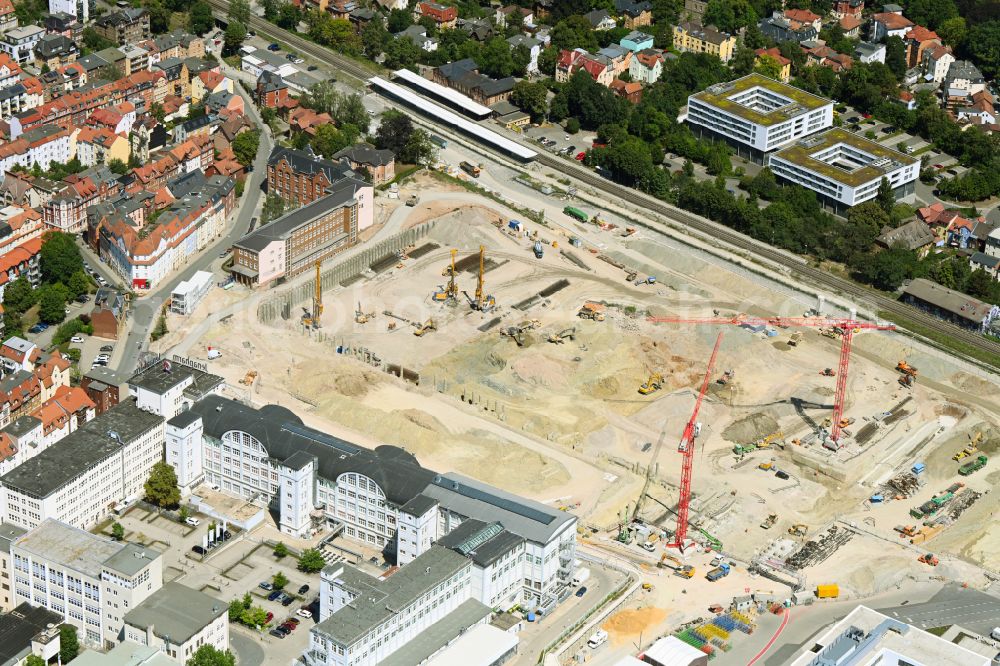 Aerial image Jena - Construction site for the new construction of an office and commercial building for the new company headquarters for the Medical Technology and Research Microscopy Solutions division of Carl Zeiss Meditec AG and Carl Zeiss AG on street Otto-Schott-Strasse in Jena in the state of Thuringia, Germany