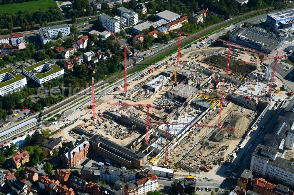Aerial image Jena - Construction site for the new construction of an office and commercial building for the new company headquarters for the Medical Technology and Research Microscopy Solutions division of Carl Zeiss Meditec AG and Carl Zeiss AG on street Otto-Schott-Strasse in Jena in the state of Thuringia, Germany