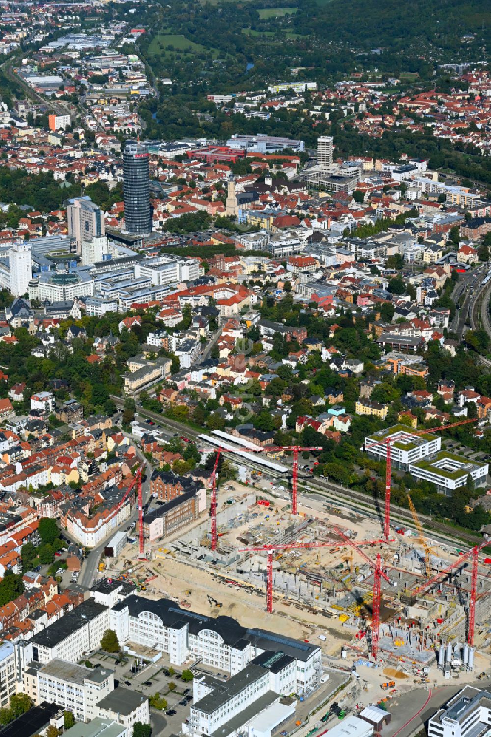 Jena from the bird's eye view: Construction site for the new construction of an office and commercial building for the new company headquarters for the Medical Technology and Research Microscopy Solutions division of Carl Zeiss Meditec AG and Carl Zeiss AG on street Otto-Schott-Strasse in Jena in the state of Thuringia, Germany