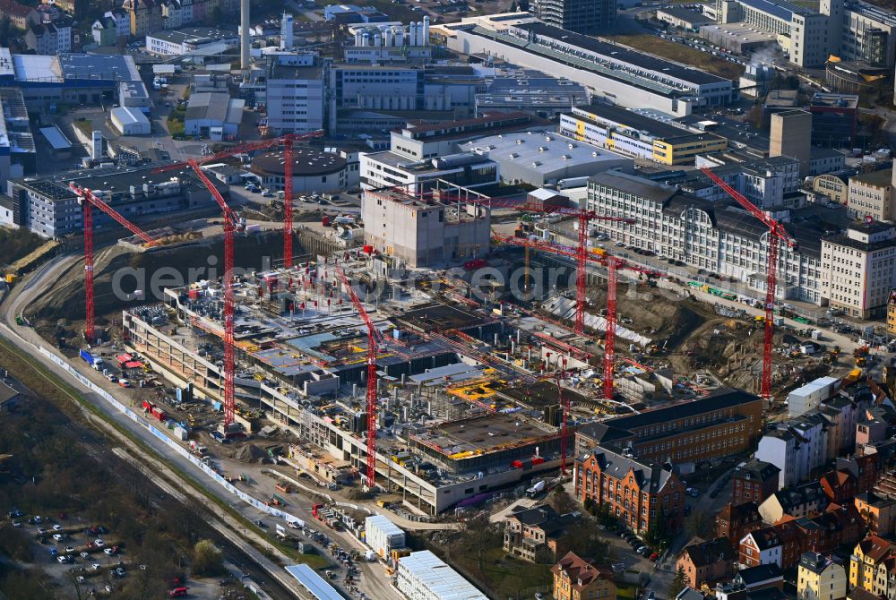 Jena from above - Construction site for the new construction of an office and commercial building for the new company headquarters for the Medical Technology and Research Microscopy Solutions division of Carl Zeiss Meditec AG and Carl Zeiss AG on street Otto-Schott-Strasse in Jena in the state of Thuringia, Germany
