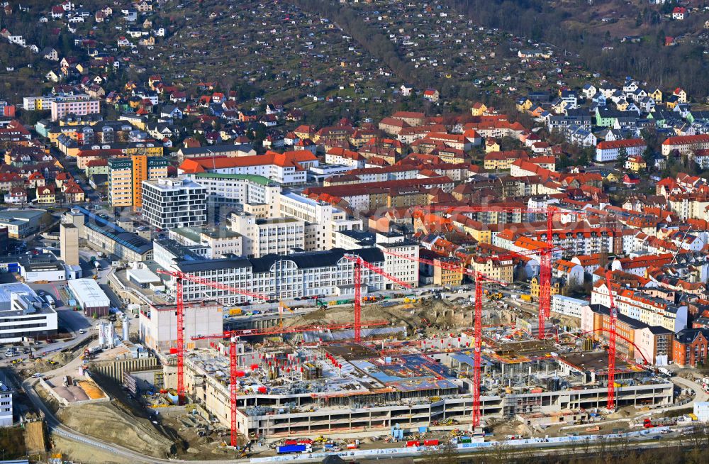 Aerial photograph Jena - Construction site for the new construction of an office and commercial building for the new company headquarters for the Medical Technology and Research Microscopy Solutions division of Carl Zeiss Meditec AG and Carl Zeiss AG on street Otto-Schott-Strasse in Jena in the state of Thuringia, Germany