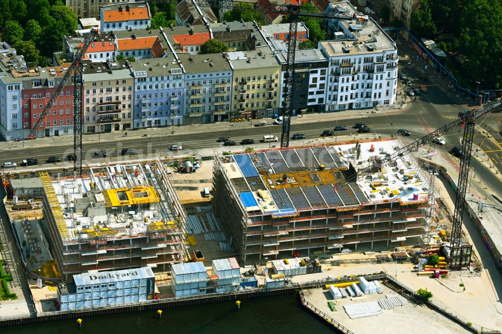 Berlin from the bird's eye view: Construction site to build a new office and commercial building Dockyard Waterfront Offices of East-Port-Area GmbH on street Stralauer Allee in the district Friedrichshain in Berlin, Germany