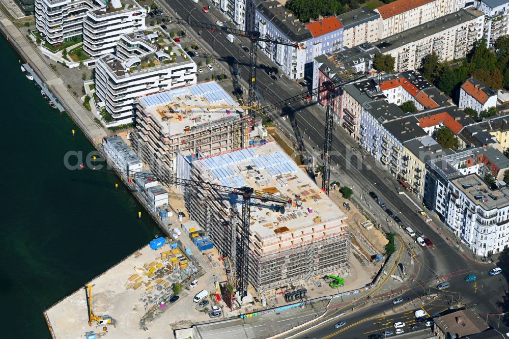 Aerial photograph Berlin - Construction site to build a new office and commercial building Dockyard Waterfront Offices of East-Port-Area GmbH on street Stralauer Allee in the district Friedrichshain in Berlin, Germany