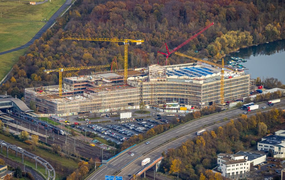Düsseldorf from the bird's eye view: Construction site for a new office and commercial building EUREF-Campus, an innovative office location directly at Dusseldorf airport train station in the Lohausen district of Dusseldorf in the Ruhr area in the state of North Rhine-Westphalia, Germany