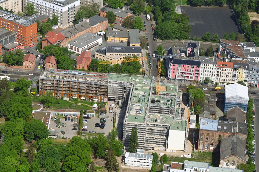 Berlin from above - Construction site to build a new office and commercial building on the site of the former UCI film theater and cinema building on Landsberger Allee in the district Friedrichshain in Berlin, Germany