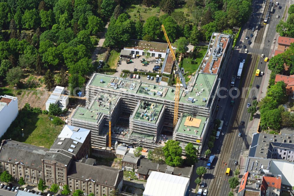 Aerial photograph Berlin - Construction site to build a new office and commercial building on the site of the former UCI film theater and cinema building on Landsberger Allee in the district Friedrichshain in Berlin, Germany