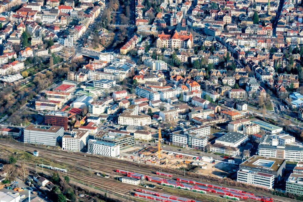 Freiburg im Breisgau from the bird's eye view: Construction site to build a new office and commercial building on Heinrich-von-Stephan-Strasse in Freiburg im Breisgau in the state Baden-Wurttemberg, Germany