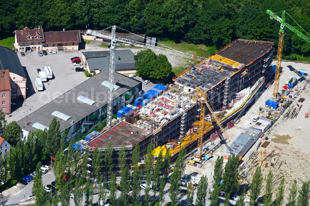 Aschheim from above - Construction site to build a new office and commercial building on Karl-Hammerschmidt-Strasse in the district Dornach in Aschheim in the state Bavaria, Germany