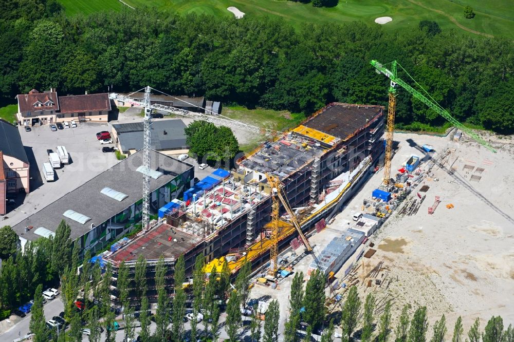 Aschheim from the bird's eye view: Construction site to build a new office and commercial building on Karl-Hammerschmidt-Strasse in the district Dornach in Aschheim in the state Bavaria, Germany
