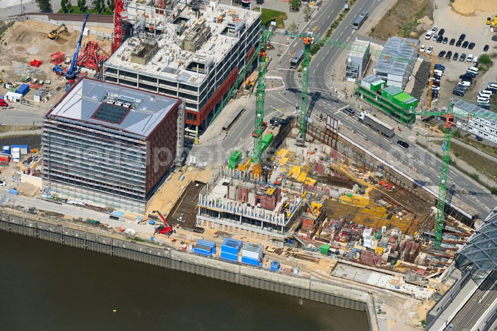 Hamburg from the bird's eye view: Construction site for a new office and commercial building on Kirchenpauerstrasse - Zweibrueckenstrasse in the Elbbruecken district at the Braakenhafen in the district HafenCity in Hamburg, Germany