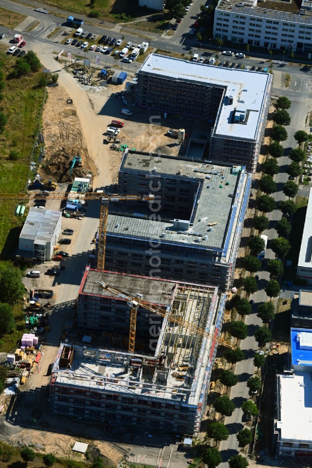 Schönefeld from the bird's eye view: Construction site to build a new office and commercial building on Mizarstrasse in Schoenefeld in the state Brandenburg, Germany
