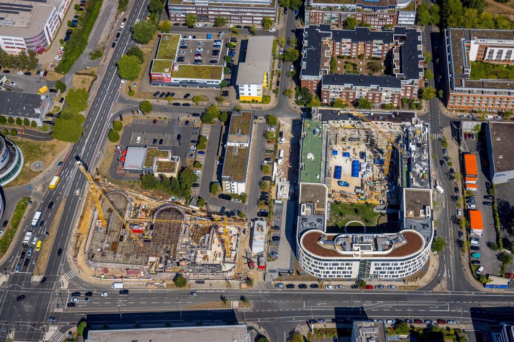 Essen from the bird's eye view: Construction site to build a new office and commercial building Max & Moritz on Frohnhauser street in the district Westviertel in Essen at Ruhrgebiet in the state North Rhine-Westphalia, Germany