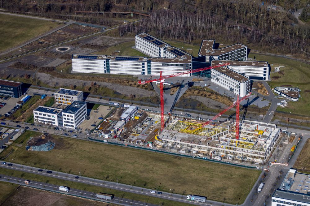 Dortmund from the bird's eye view: Construction site to build a new office and commercial building on Robert-Schuman-Strasse in the district Phoenix West in Dortmund at Ruhrgebiet in the state North Rhine-Westphalia, Germany