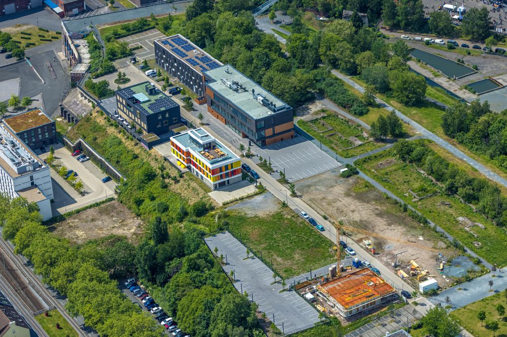 Bochum from the bird's eye view: Construction site to build a new office and administration building Industrie- and Handelskammer Mittleres Ruhrgebiet on place Gerard-Mortier-Platz in Bochum at Ruhrgebiet in the state North Rhine-Westphalia, Germany