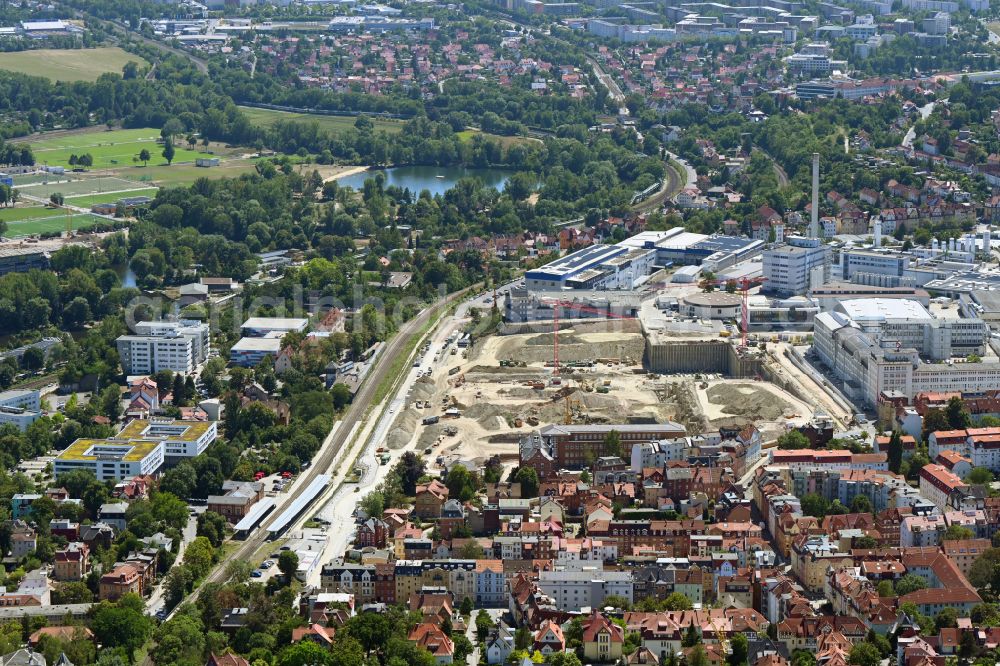 Jena from the bird's eye view: Construction site for the new construction of an office and commercial building for the new company headquarters for the Medical Technology and Research Microscopy Solutions division of Carl Zeiss AG on street Otto-Schott-Strasse in Jena in the state of Thuringia, Germany