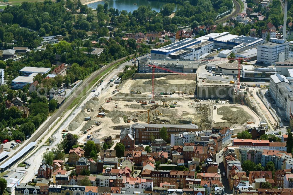 Aerial image Jena - Construction site for the new construction of an office and commercial building for the new company headquarters for the Medical Technology and Research Microscopy Solutions division of Carl Zeiss AG on street Otto-Schott-Strasse in Jena in the state of Thuringia, Germany