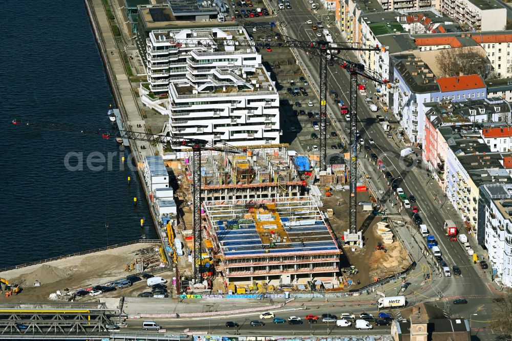 Aerial photograph Berlin - Construction site to build a new office and commercial building Dockyard Waterfront Offices of East-Port-Area GmbH on street Stralauer Allee in the district Friedrichshain in Berlin, Germany