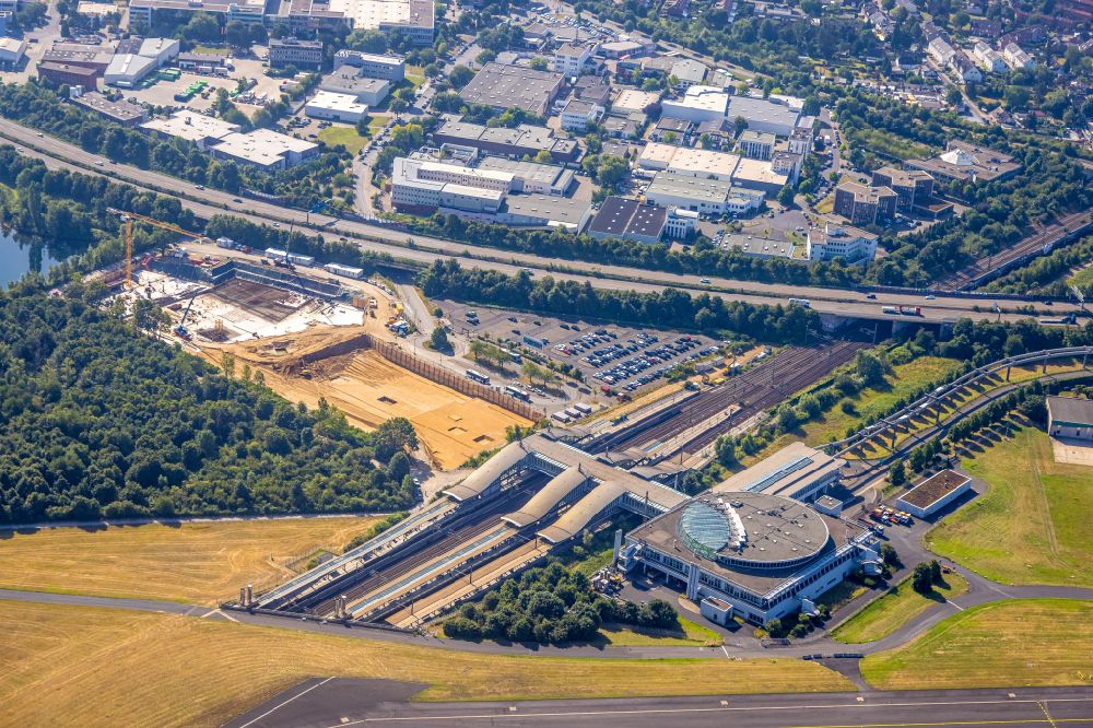 Düsseldorf from the bird's eye view: Construction site for a new office and commercial building EUREF-Campus, an innovative office location directly at Dusseldorf airport train station in the Lohausen district of Dusseldorf in the Ruhr area in the state of North Rhine-Westphalia, Germany