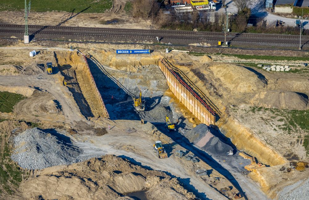 Aerial photograph Westtünnen - Construction site for the new construction of a tunnel - railway culvert and rainwater retention basin and water reservoir on Verdistrasse in Westtuenen in the Ruhr area in the state of North Rhine-Westphalia, Germany