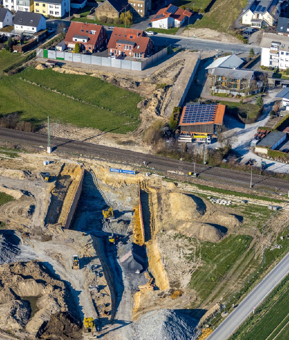 Westtünnen from the bird's eye view: Construction site for the new construction of a tunnel - railway culvert and rainwater retention basin and water reservoir on Verdistrasse in Westtuenen in the Ruhr area in the state of North Rhine-Westphalia, Germany