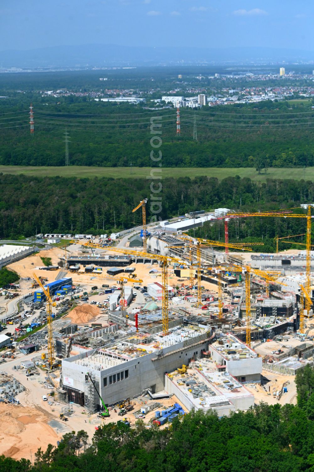 Darmstadt from the bird's eye view: Construction site for the new building of a research building and office complex Beschleunigerzentrum FAIR in the district Wixhausen in Darmstadt in the state Hesse, Germany