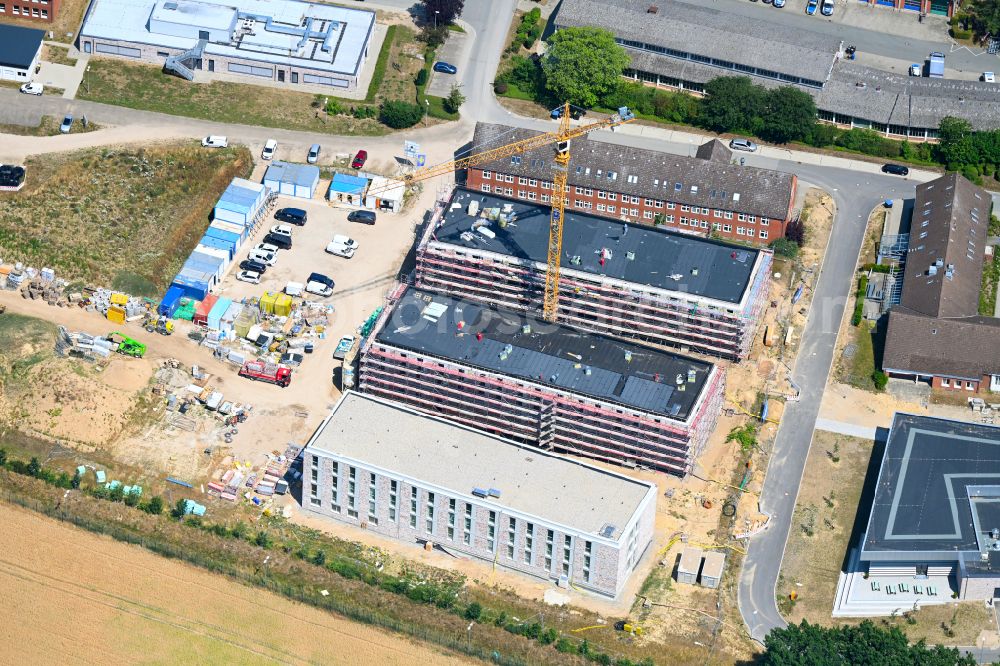 Aerial image Eutin - Construction site for the construction of a new police building complex accommodation building and an operational training center of the police department for basic and advanced training and for the riot police in the district of Fissau in Eutin in the state Schleswig-Holstein, Germany