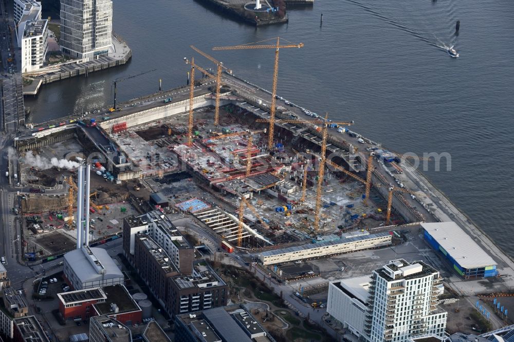 Hamburg from the bird's eye view: Construction site for the new building complex of the shopping center at Ueberseequartier at Chicagokai - Osakaallee in the area of the former Grasbrooks in the Hafencity district in Hamburg, Germany