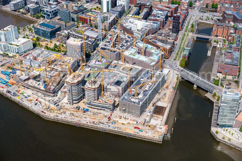 Aerial image Hamburg - Construction site for the new building complex of the shopping center at Ueberseequartier at Strandkai in the Hafencity district in Hamburg, Germany
