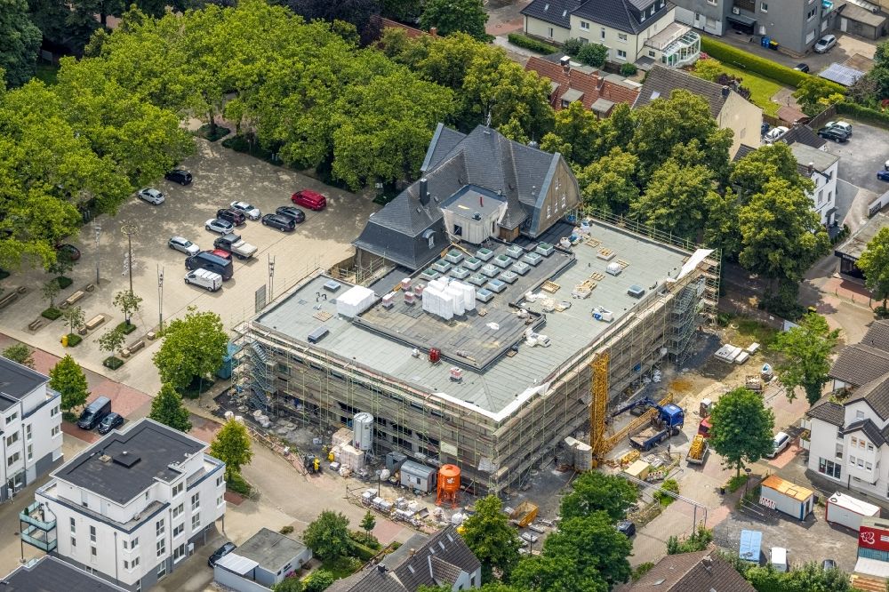 Holzwickede from the bird's eye view: Construction site of Town Hall building of the city administration as a building extension Am Markt - Poststrasse in the district Brackel in Holzwickede at Ruhrgebiet in the state North Rhine-Westphalia, Germany