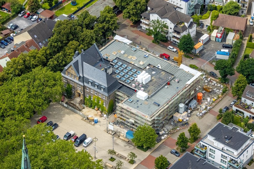 Holzwickede from the bird's eye view: Construction site of Town Hall building of the city administration as a building extension Am Markt - Poststrasse in the district Brackel in Holzwickede at Ruhrgebiet in the state North Rhine-Westphalia, Germany