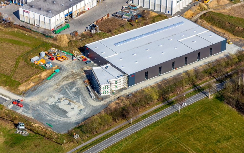 Meschede from the bird's eye view: New building - construction site on the factory premises Noelle Nodeko Kunststofftechnik in the district Enste in Meschede in the state North Rhine-Westphalia, Germany