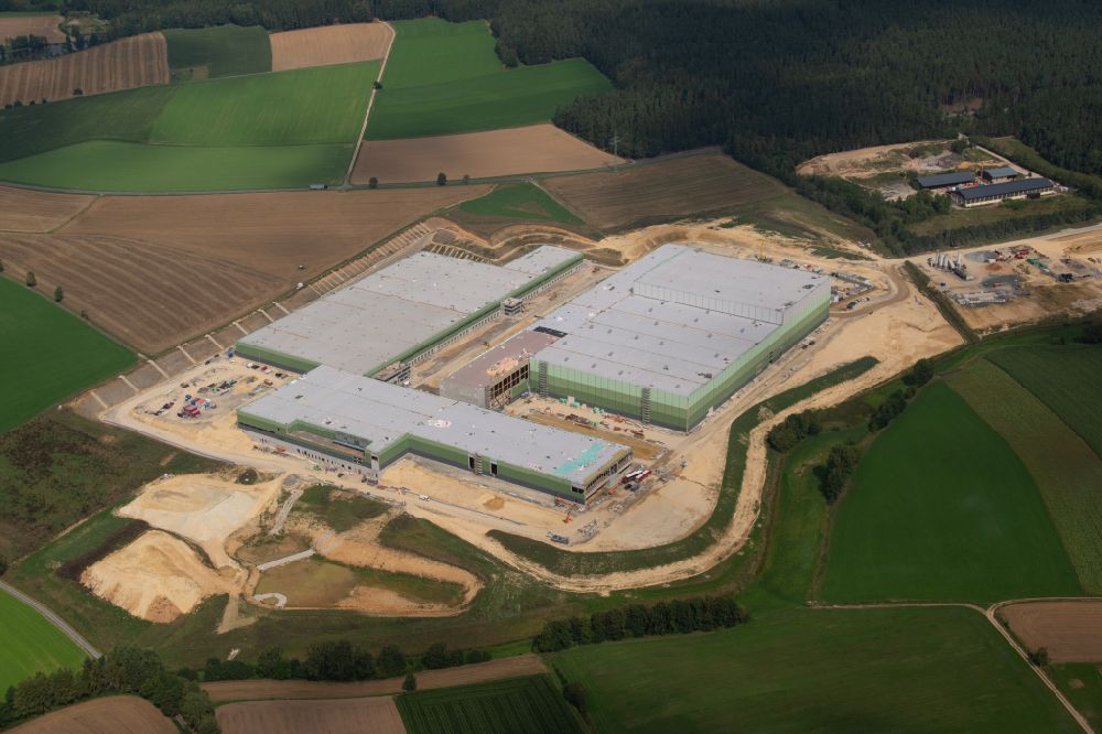 Marktredwitz from the bird's eye view: Construction site and assembly work for the construction of a high-bay warehouse building complex and logistics center EDEKA on street Rathaushuette in Marktredwitz in the state Bavaria, Germany