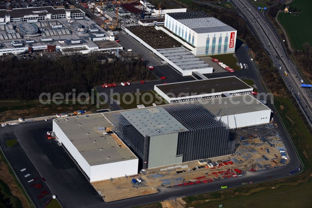 Günthersdorf from above - Construction site and assembly work for the construction of a high-bay warehouse building complex and logistics center on the premises of Hoeffner Moebelgesellschaft GmbH & Co.KG in Guenthersdorf in the state Saxony-Anhalt