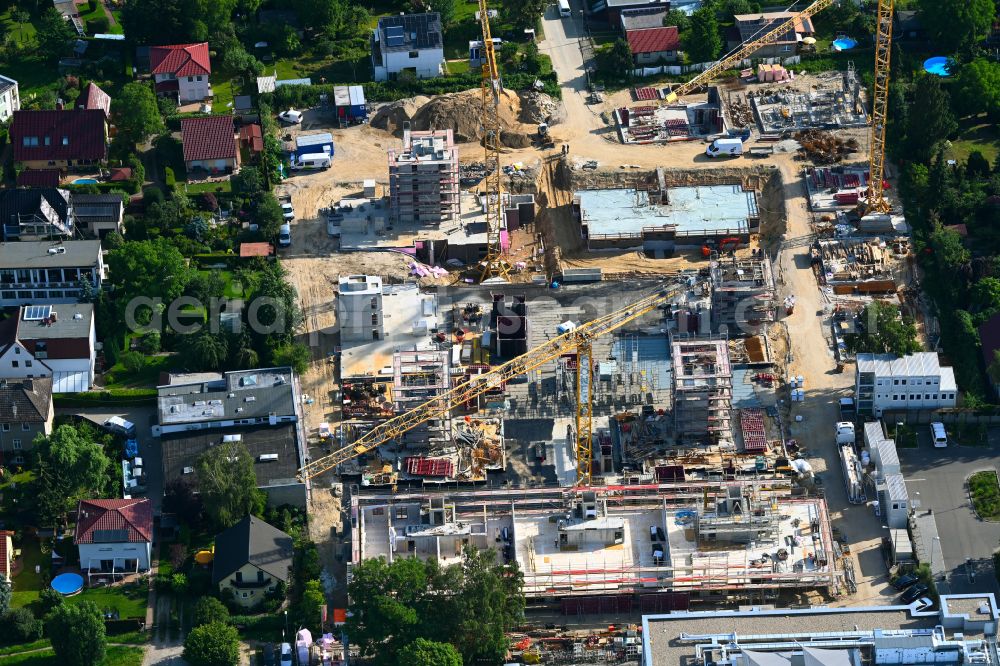 Berlin from above - Construction site to build a new multi-family residential complex on street Muensterberger Weg in the district Kaulsdorf in Berlin, Germany