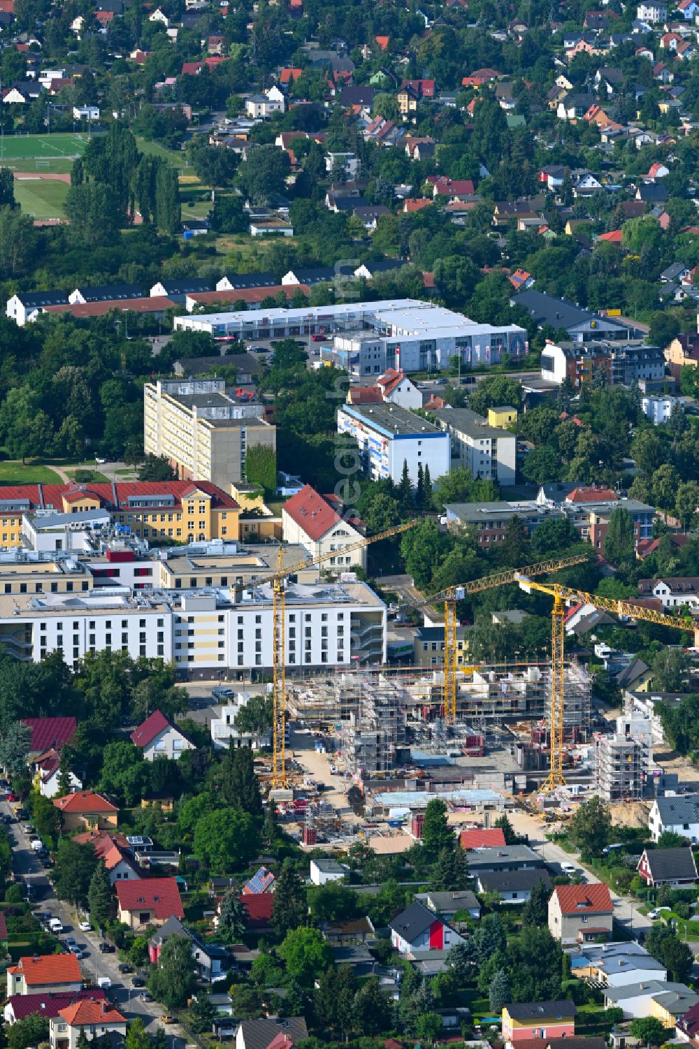 Berlin from above - Construction site to build a new multi-family residential complex on street Muensterberger Weg in the district Kaulsdorf in Berlin, Germany