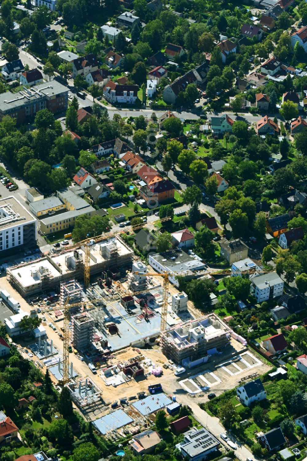 Aerial image Berlin - Construction site to build a new multi-family residential complex on street Muensterberger Weg in the district Kaulsdorf in Berlin, Germany