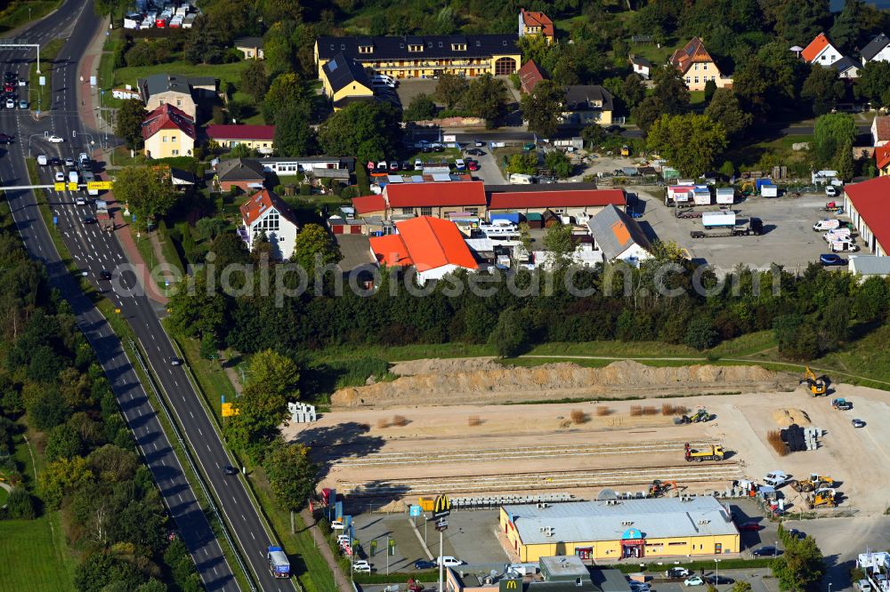 Hönow from the bird's eye view: Construction site for the new construction of a storage house and self-storage building on Neue Mehrower Strasse - Altlandsberger Chaussee in Hoenow in the federal state of Brandenburg, Germany